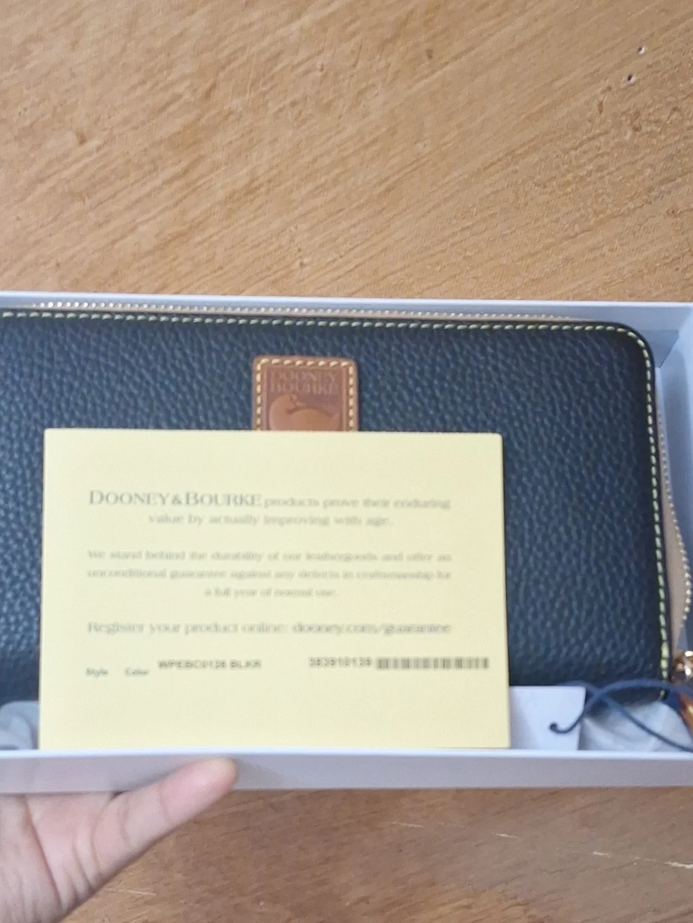 Dooney & Bourke Black Pebbled Zip Wallet with Tan Trim